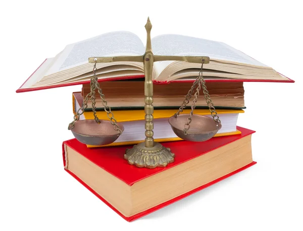 dep_3815412-Scales-of-justice-atop-legal-books-over-white.jpg